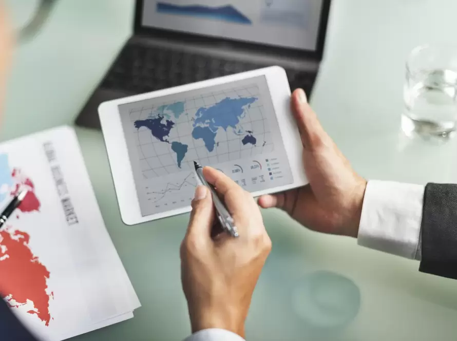 How to Optimize International Taxation in Holding Companies and Business Structures 3 Professionals analyzing international Taxation in Holding Companies strategies on a global map.